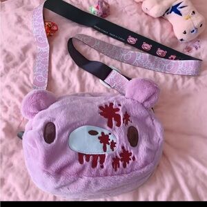 Gloomy Bear plush crossbody bag: Pink, cute - edgy with “blood - splatter”.